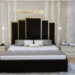 Angel black velvet upholstered strip bed with tall panelled headboard